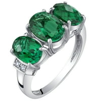 Ovalni oblik Oravo ct stvorio je smaragdni i dijamantski prsten od tri kamena u 14k bijelom zlatu